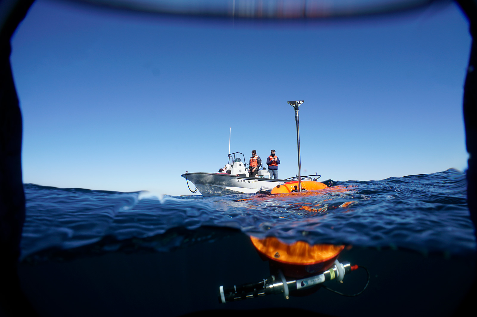 ng from buoy in blue water